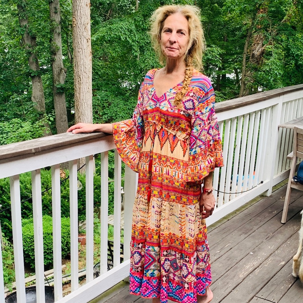 Ruby Vaya…size small…lined has a tie below chest with pompoms